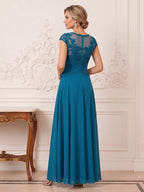 Jocelyn Blythe Peacock back view mother of the bride dress