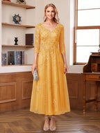 Caroline Claire Gold back view mother of the bride dress