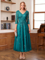 Caroline Claire Peacock front view mother of the bride dress