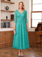 Caroline Claire Turquoise back view mother of the bride dress