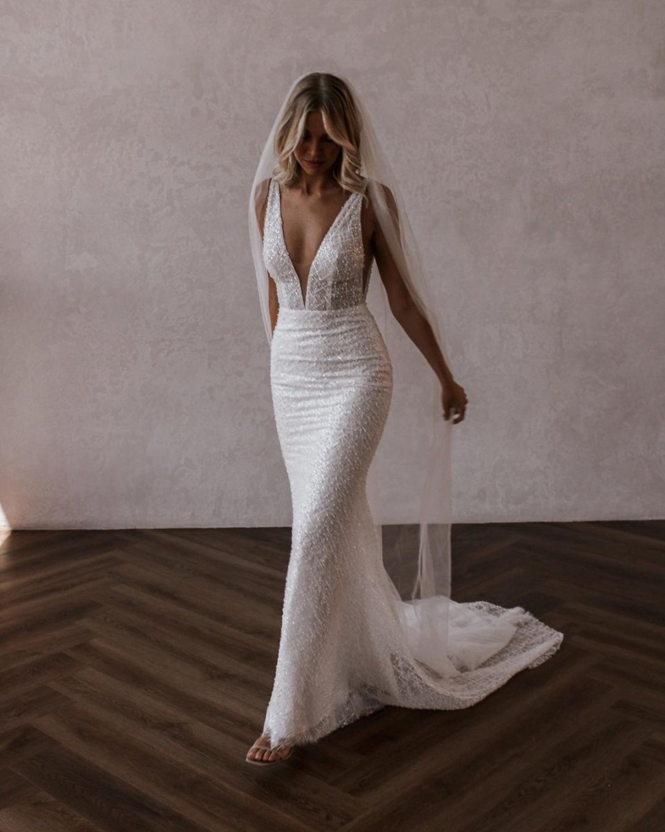 Diamond White Lace Mermaid Wedding Dress with V-Neck Neckline and Sequins