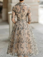 Nerissa Claire Champagne back view mother of the bride dress