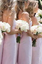 Blush Satin Sheath Bridesmaid Dress with Strapless Neckline and Pleated Detail